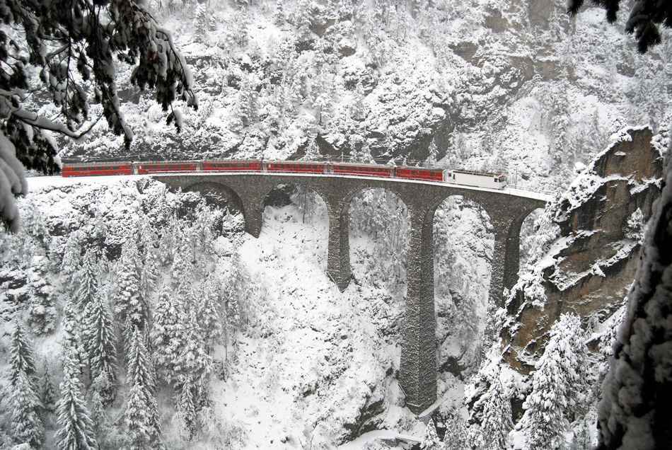 In winter conditions a train on the Landwasser viaduct.