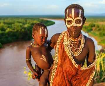 Woman from Karo tribe holding her baby, Ethiopia, Africa