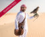 arabic sheik on the desert holding a falcon