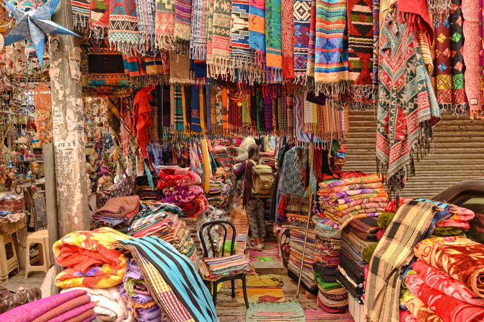 Buying scarfs at the old market in New Delhi